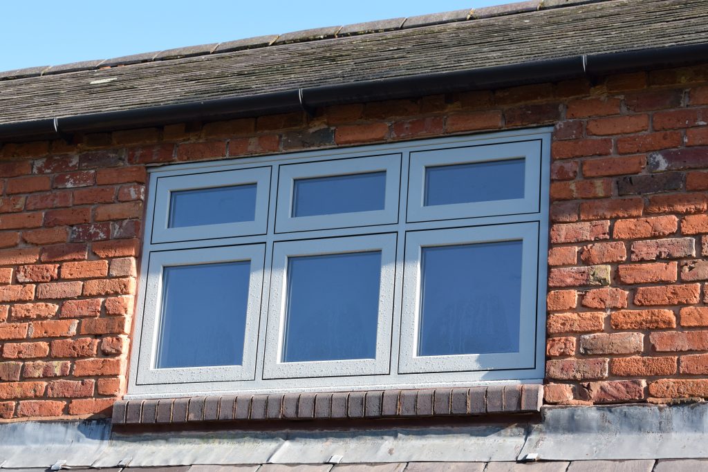 Green flush casement window.