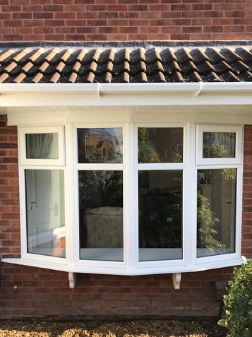 A White triple glazed bow window in Wolverhampton.